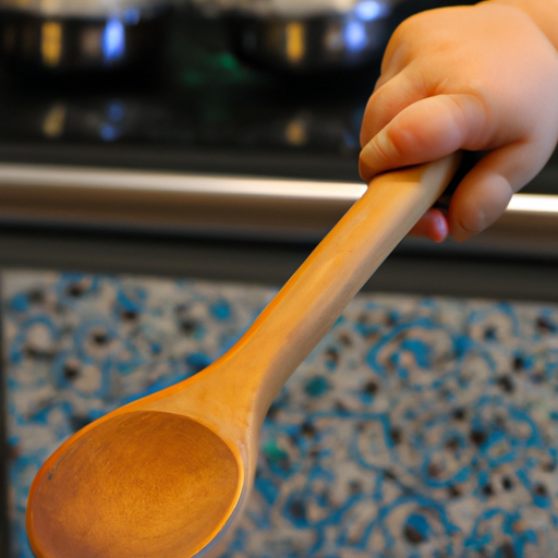 Suggested Prompt: a child's hand holding a wooden spoon in front of a kitchen stove.