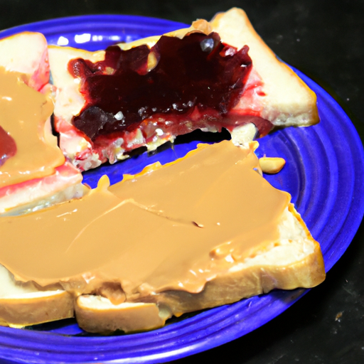 A colorful plate of cut-up pieces of a peanut butter and jelly sandwich.